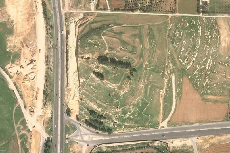 Figure 3: The main road south from Amman in Jordan cutting through Tall Umeiri (East) shown on a DigitalGlobe images from Google Earth. In early 2010, the road was widened back to the edge of a structure that had been excavated in 2009.
