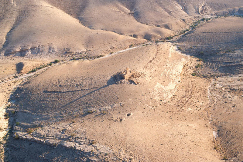 Aerial photograph of the tower from 2004 showing the preservation of the southern face. Photograph: Robert Bewley, APAAME_20040601_RHB-0016.