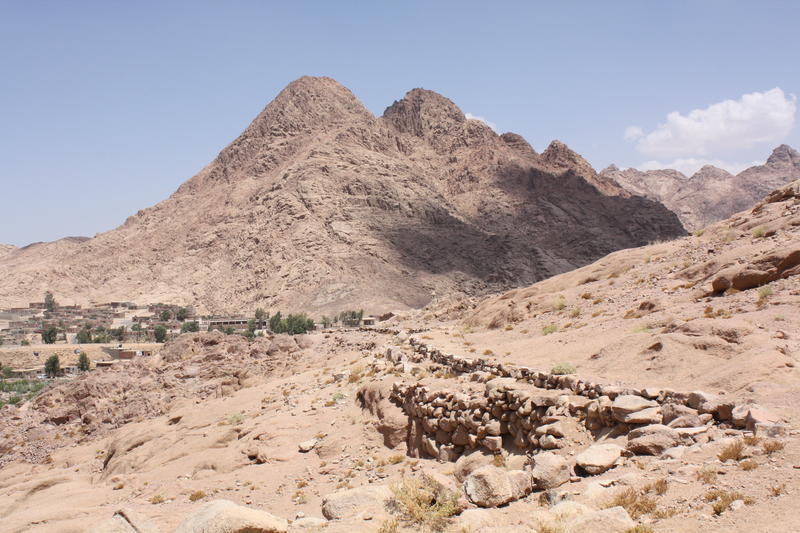 Figure 5 The Byzantine water conduit of Wadi Arba’ien (Leja) and contemporary water pipeline supplying Saint Catherine Monastery at average elevation of 1,600 m ASL (in the background are the pyramid-shaped Gebel Rubsha (El Ghabsheh) at 1,858 m ASL, and t