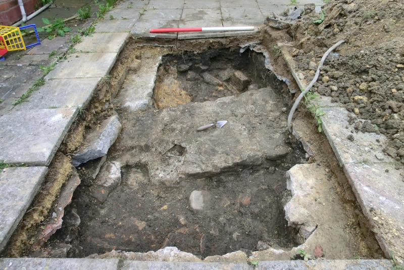 Fig. 1. Roman-period wall and earthwork bank construction deposits in the vicus of Benwell Roman fort or on the edge of the boundary of the fort, recorded during an evaluation prior to planning permission for a local extension. Photo: © Jon Welsh.